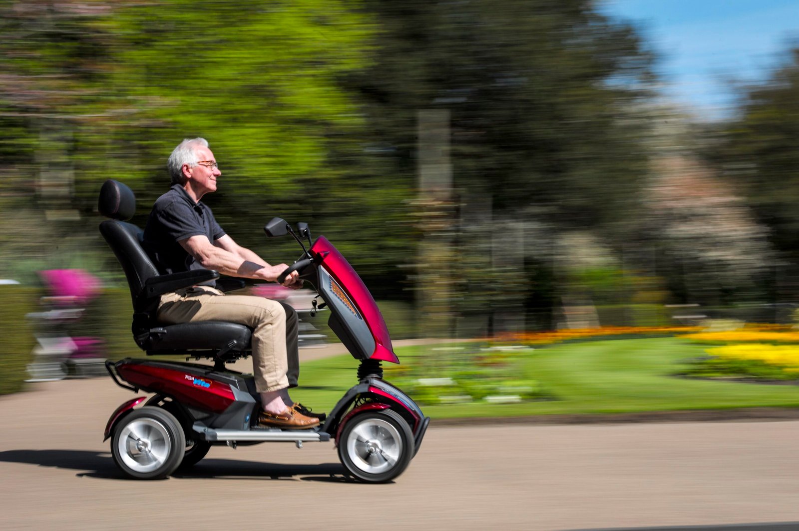 Man on a mobility scooter enjoying the park